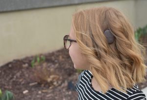 Alyssa with her Cochlear implant