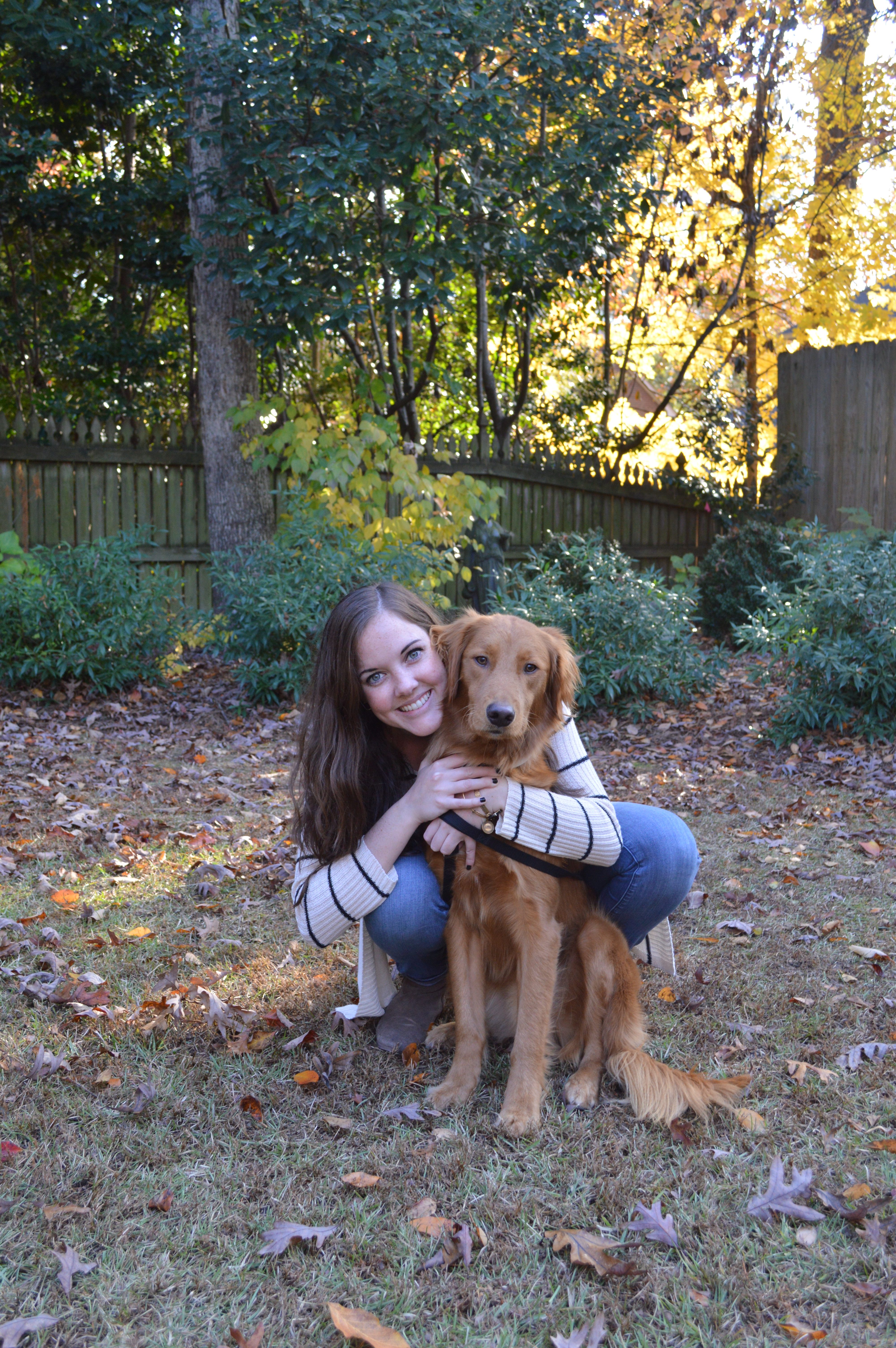 McKenna N., a Baha® recipient with her dog,Rosey