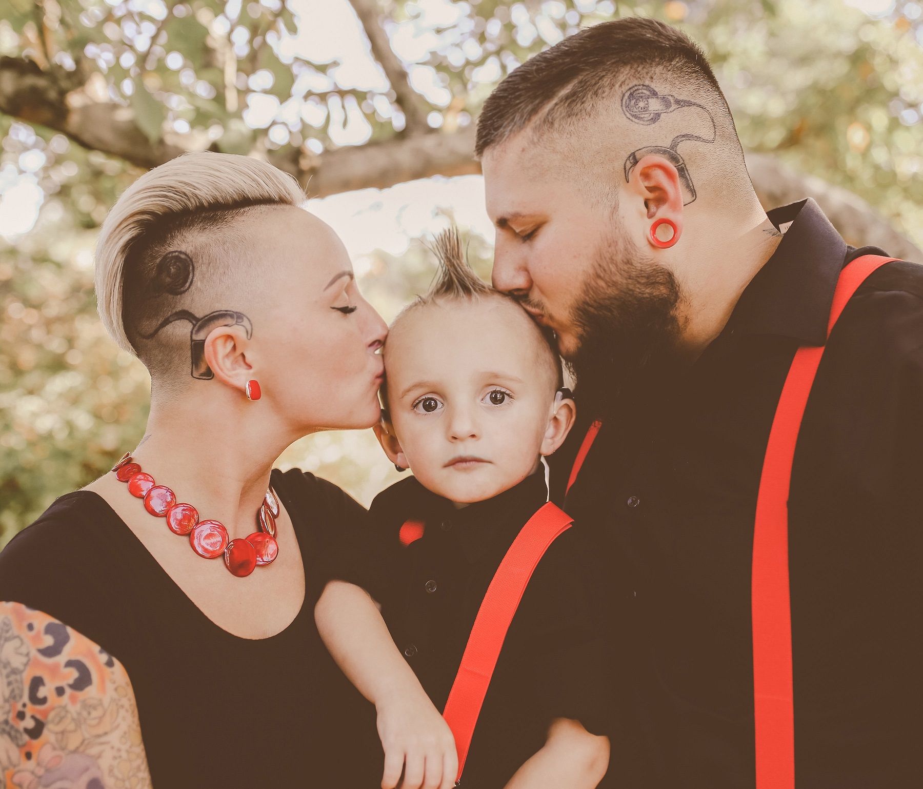 Parents with cochlear implant tattoos