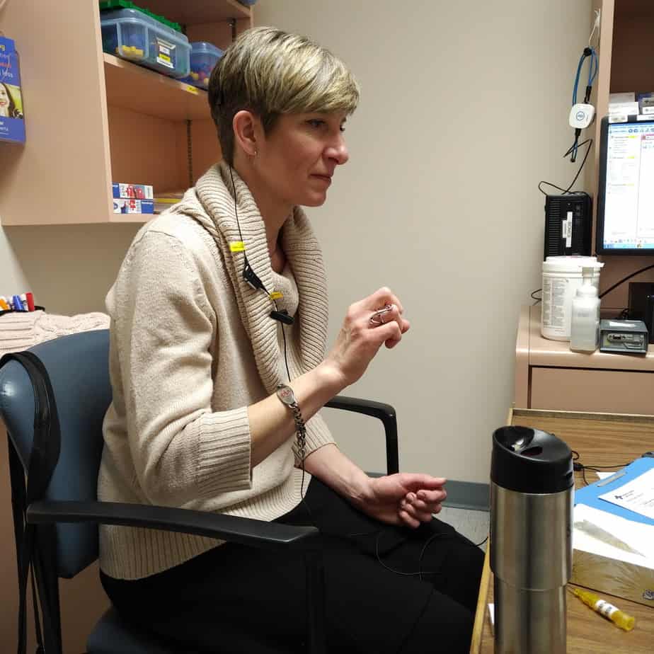 Caroline at her activation appointment after having had cochlear implant surgery