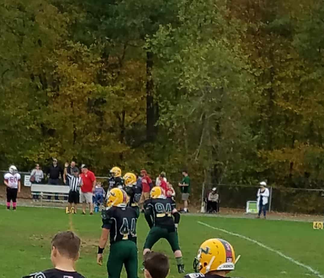 Nicholas playing football, with pediatric sensorineural hearing loss