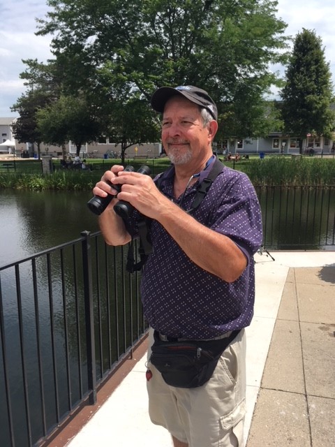 Ken, a birdwatcher with hearing loss