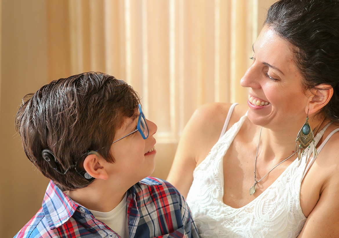 Artist with hearing loss and her son