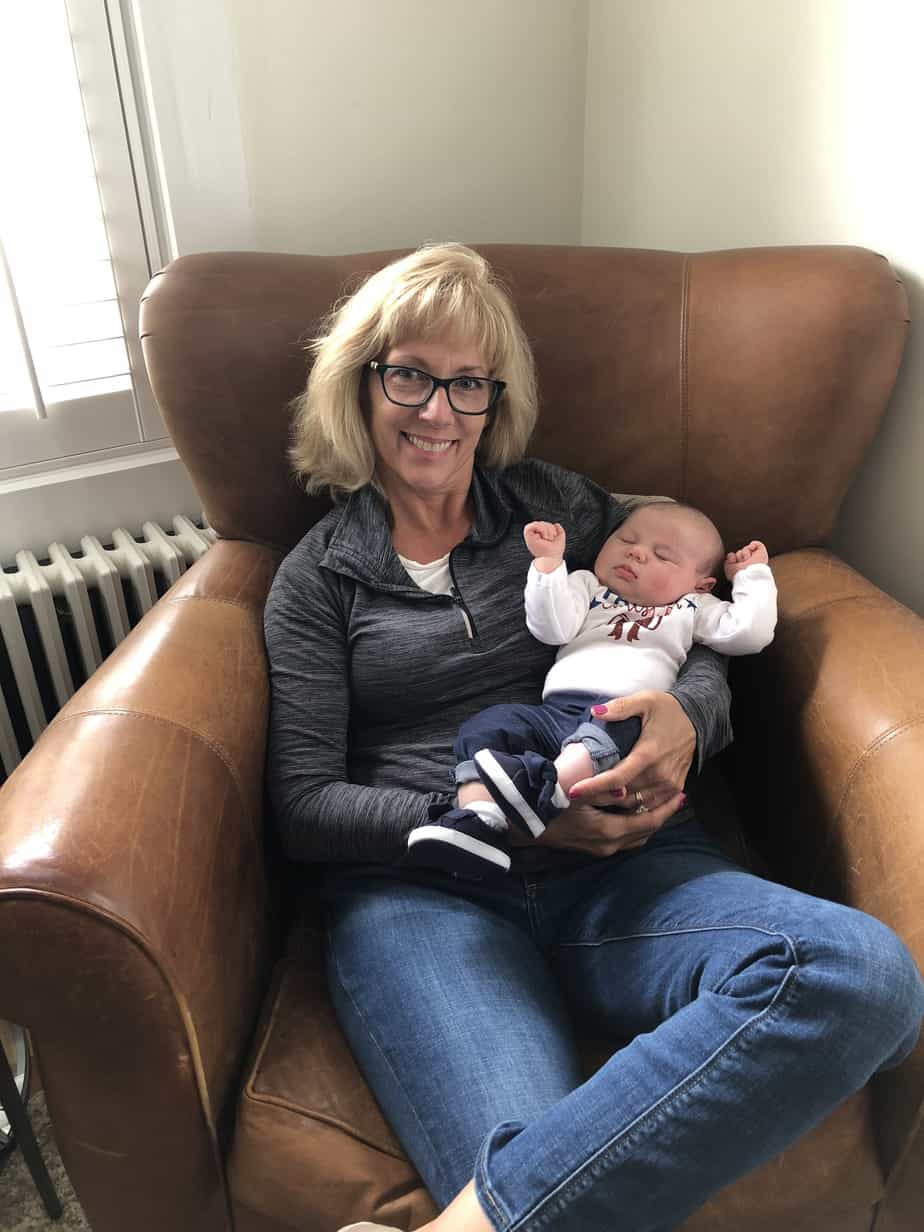 Wendy, who has a hybrid cochlear implant, with her grandchild