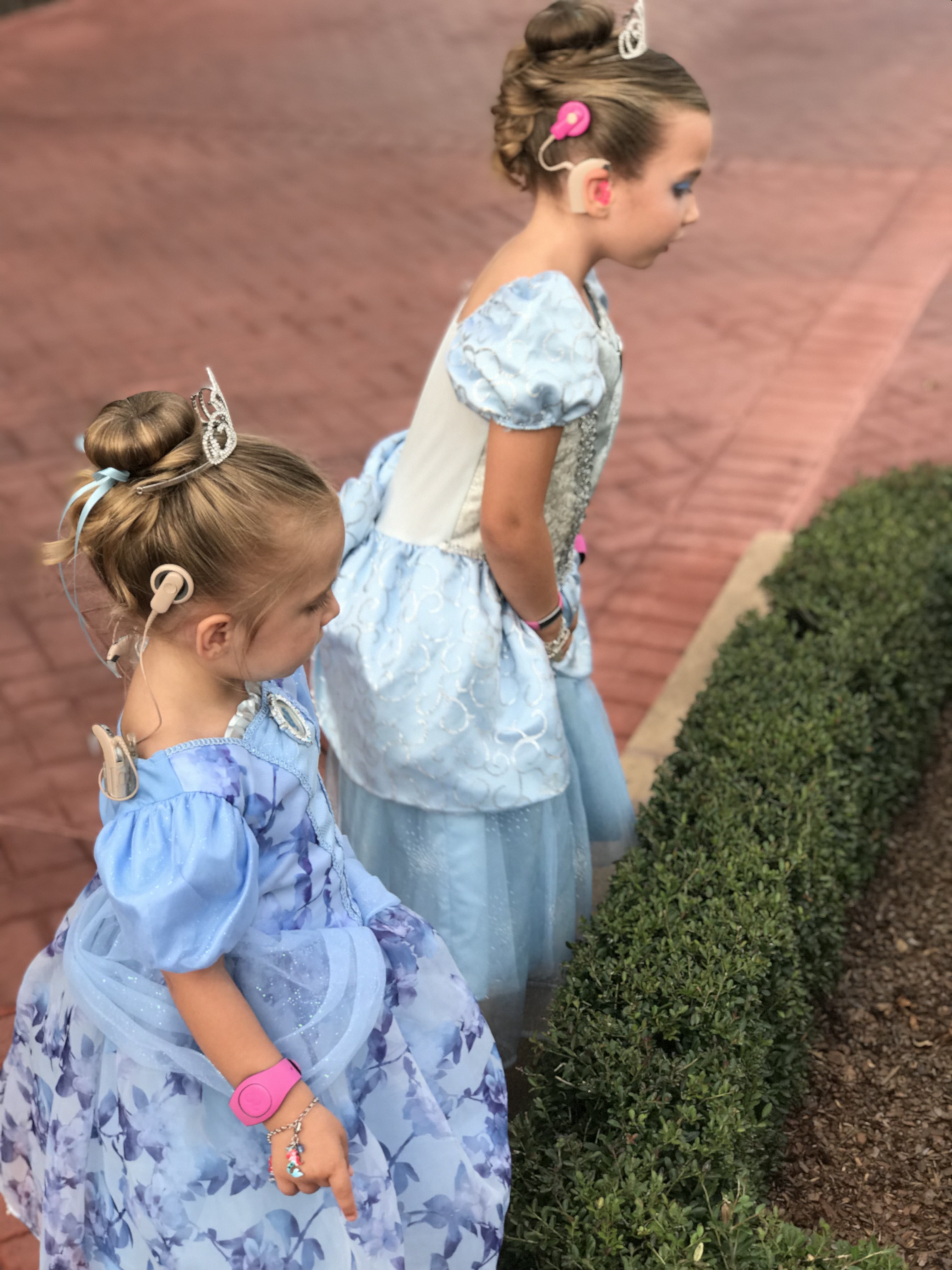 Sisters with cochlear implants at Disney