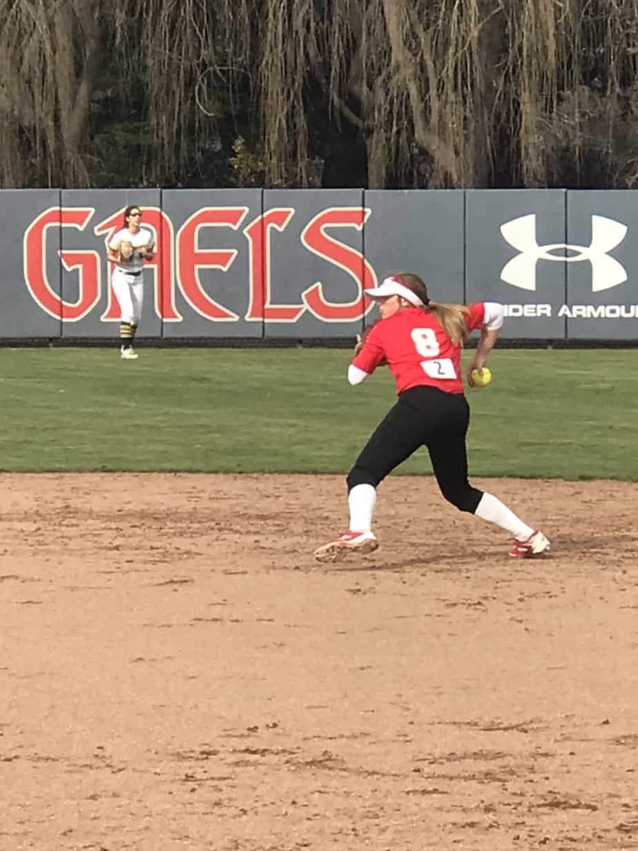 Amanda with cochlear implants playing softball after parents learned about cochlear implants