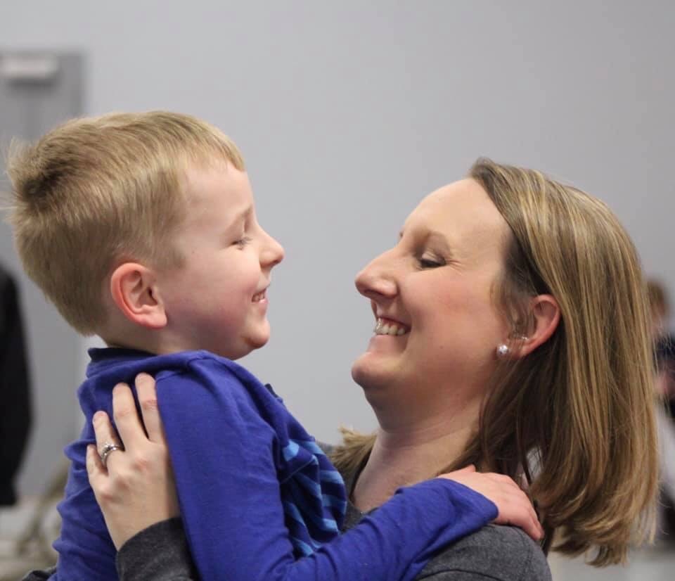 Teacher with hearing loss with son
