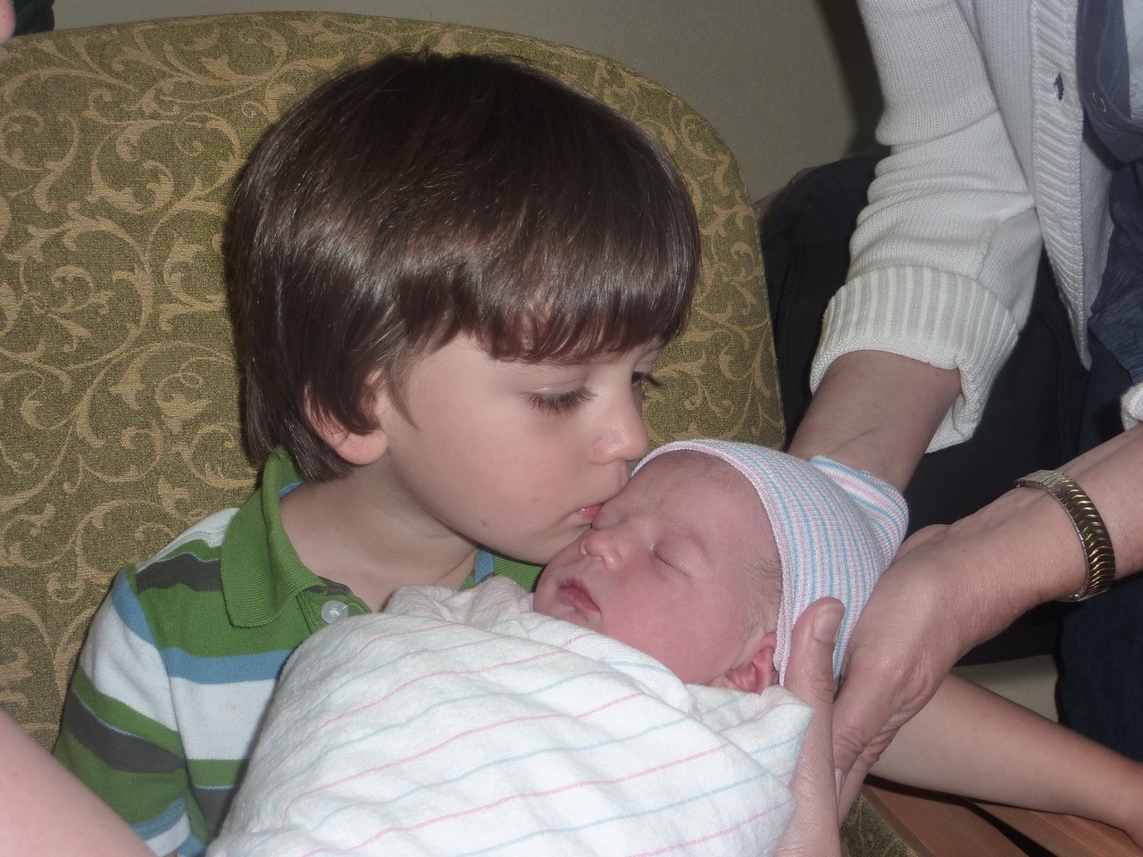 Young girl with cochlear implants, prior to getting cochlear implants, when she was born