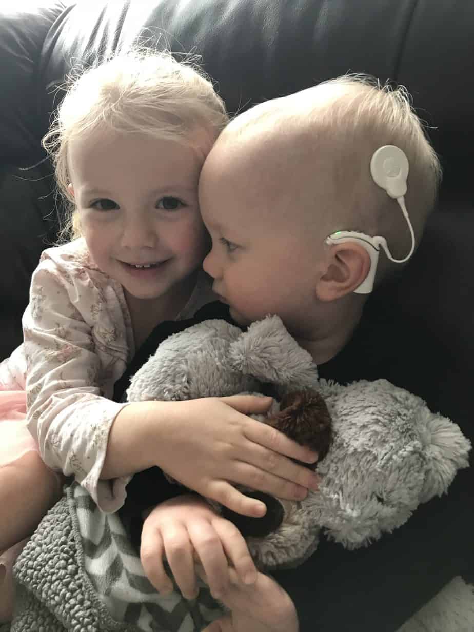 Noah, after his cochlear implant activation day, with his sister