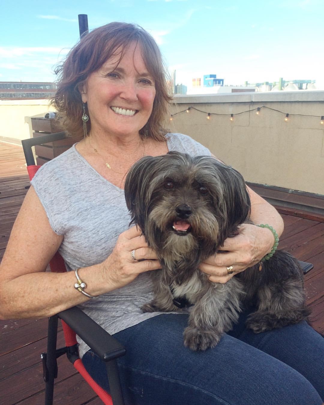 Sandy, an actress with sensorineural hearing loss diagnosis, with her dog