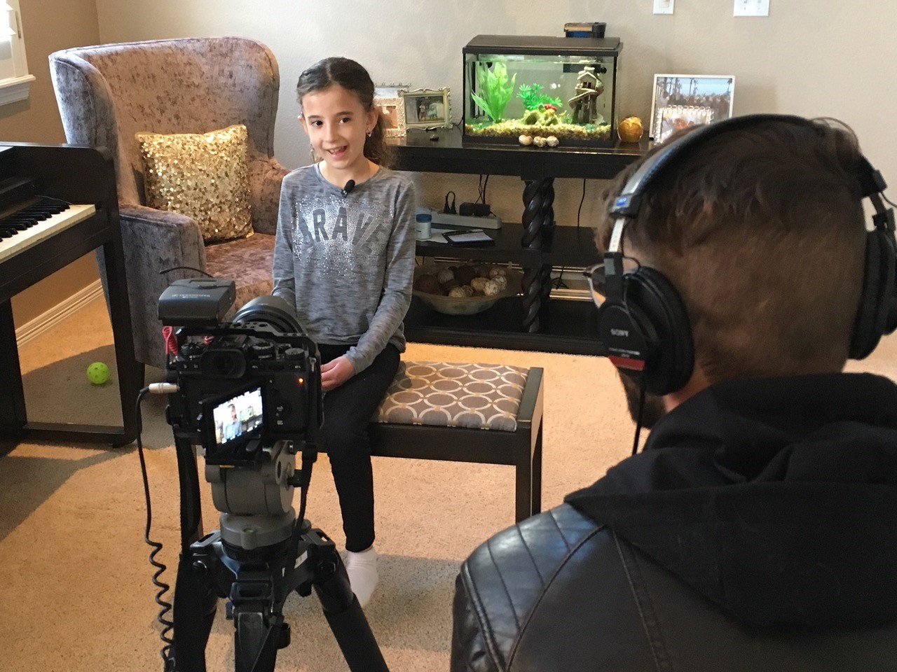 Young girl with cochlear implants getting interviewed