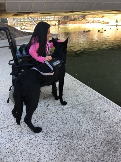 Stephania G. with the Baha 5 System with her dog
