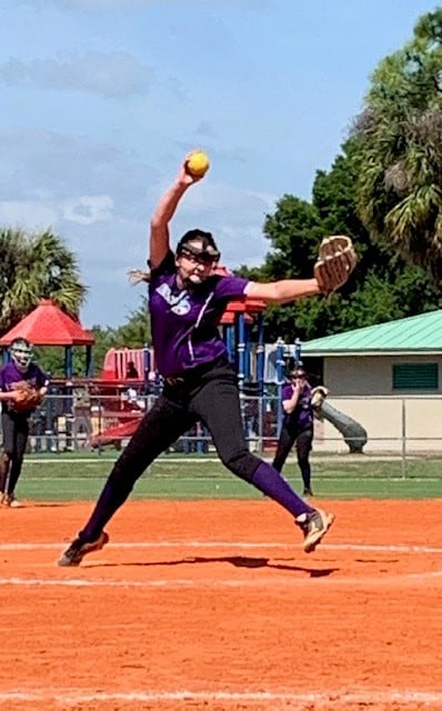 Softball player with a cochlear implant playing softball