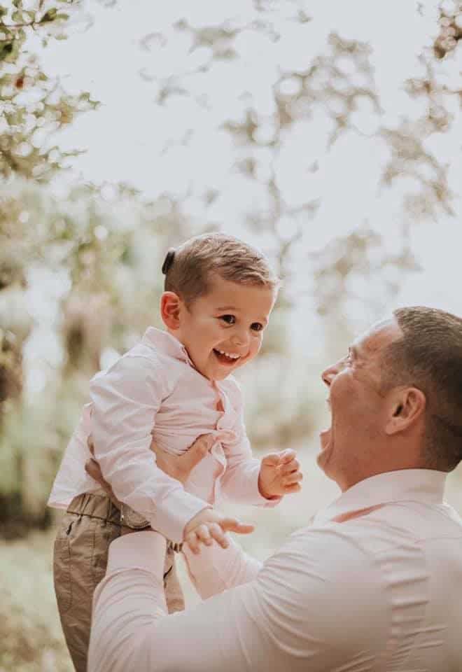 Carson, a child who failed his newborn hearing screenings, with his Dad