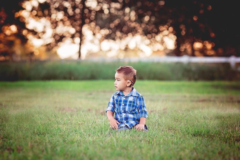 Dracen, who is bridging the language gap, with his cochlear implants