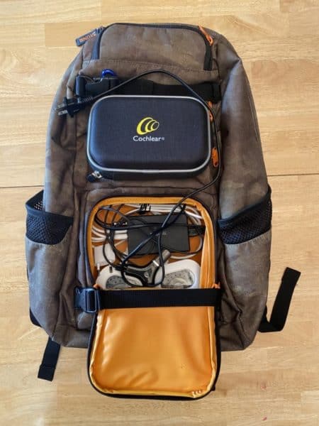 Barry's backpack with his products for traveling with a cochlear implant. 