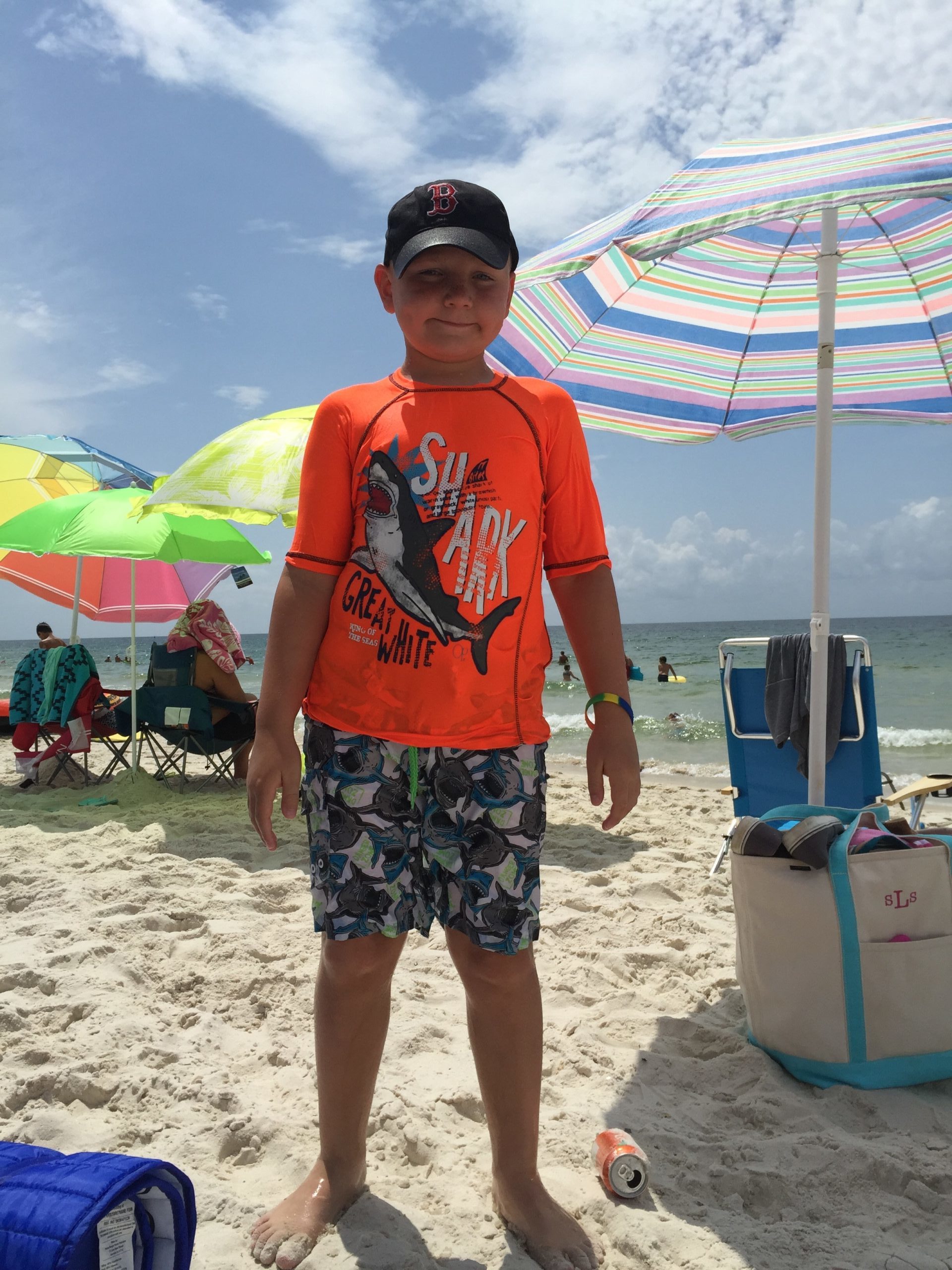 Andrew, who had hearing early intervention, at the beach