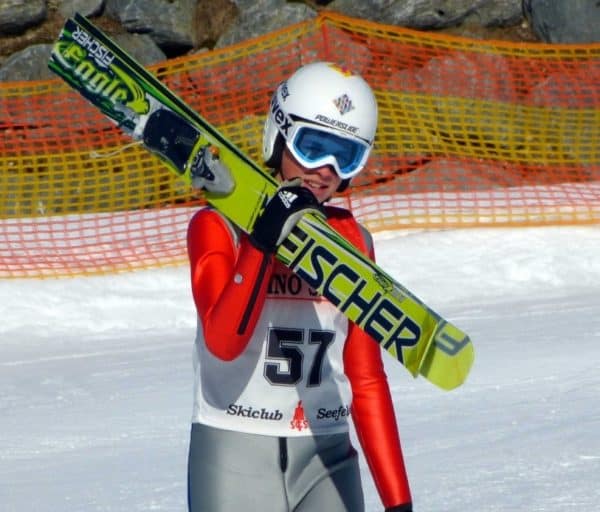 Peter stands with his skis. He is one of the winter athletes with cochlear implants.