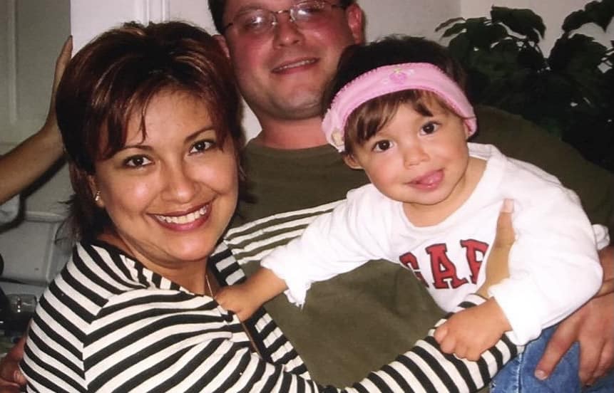 Isabella, an Osia System Recipient, with her family