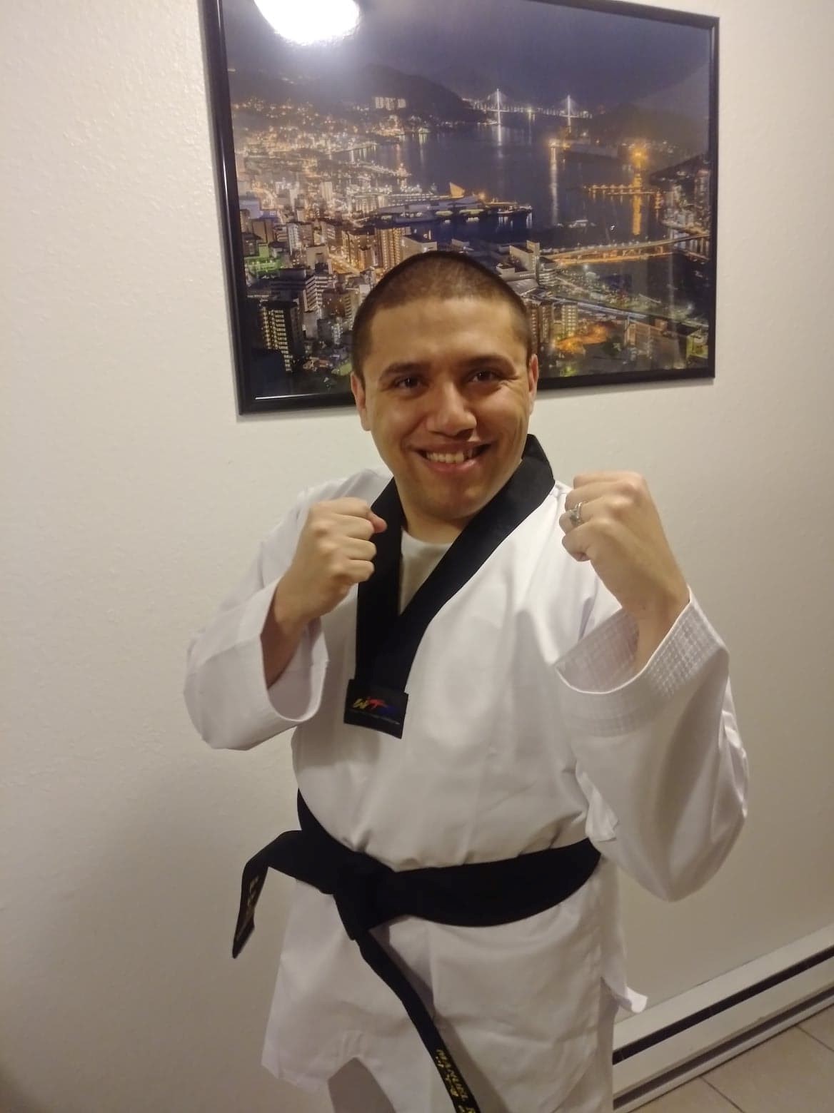 A picture of Manuel, who had sudden hearing loss, with his black belt