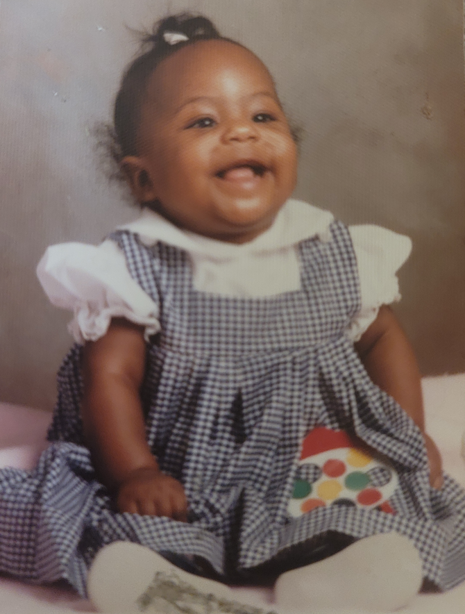 Taryn as a baby, who went from a hearing aid to a cochlear implant