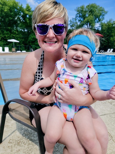 Bridget, who has hearing loss and EVA, with her mom