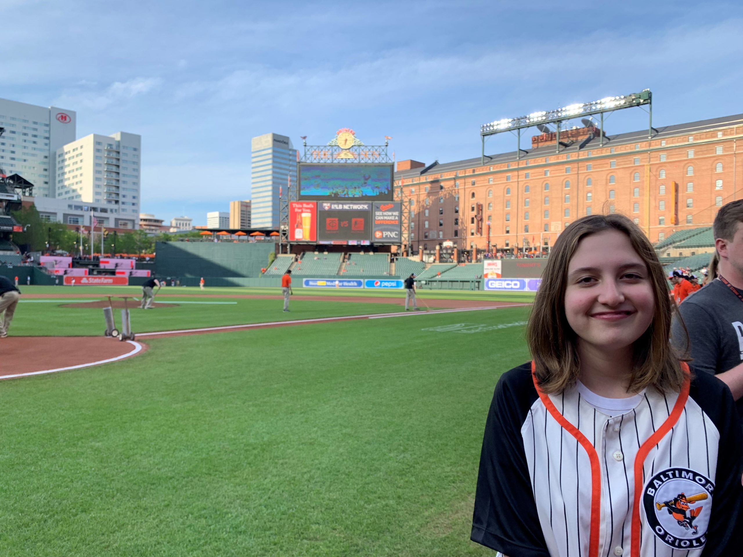 Michele, who is a cochlear implant recipient with progressive hearing loss, on the field