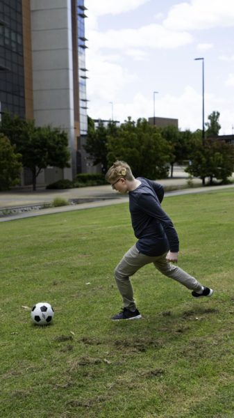 Jack plays soccer proudly wearing his Halo accessory for Kanso 2 Sound Processor.