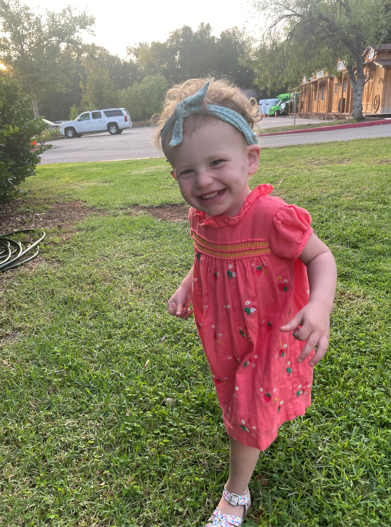 Olive, who received cochlear implants, smiling