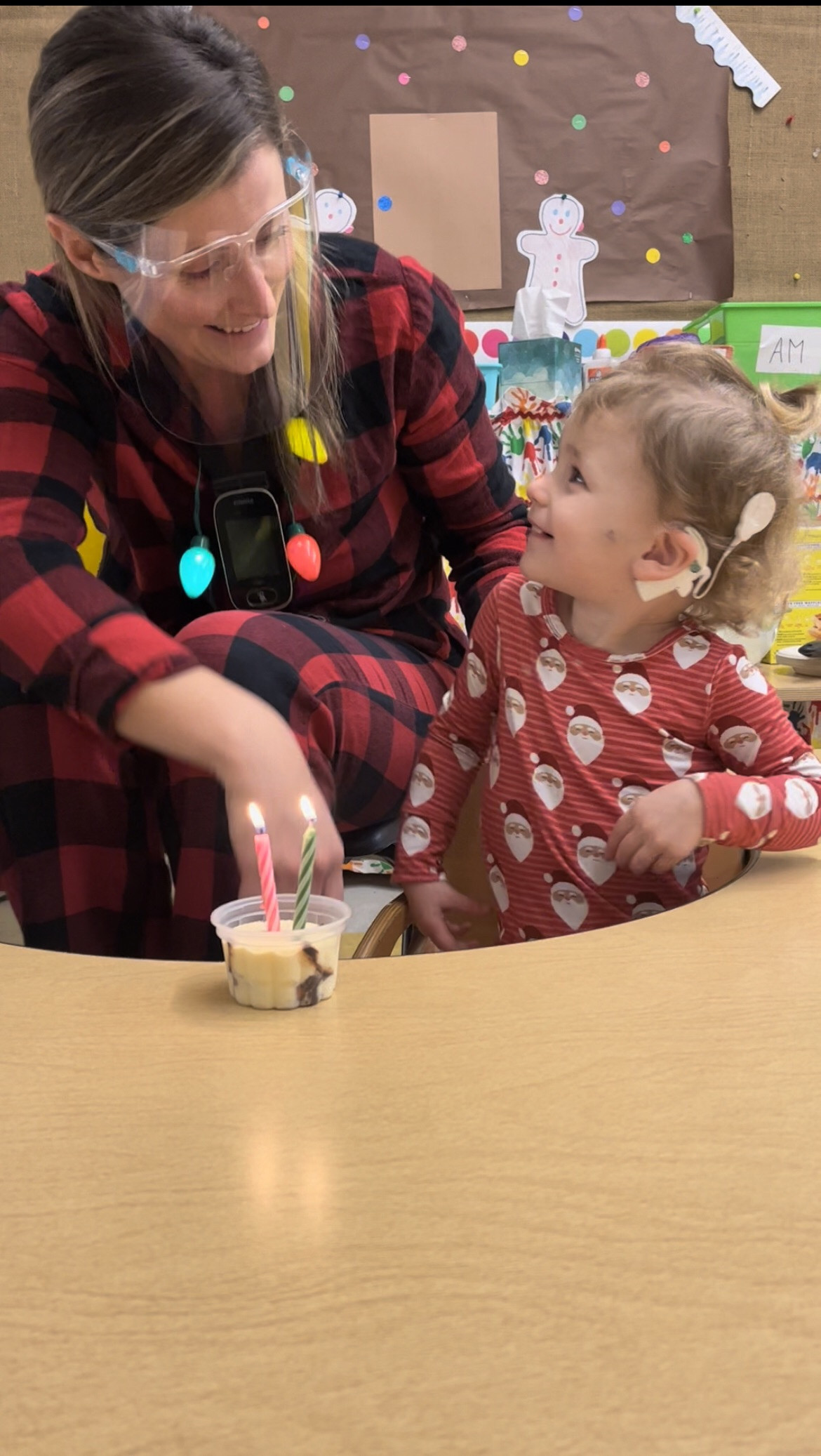 Olive, who received cochlear implants, at school