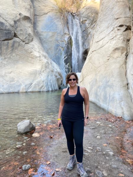 Roxanne a woman with SSD and sensorineural hearing loss standing in a canyon