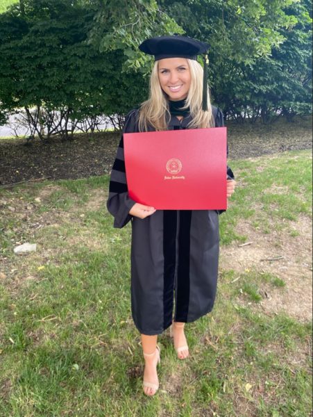 Dayle, a bilateral cochlear recipient on her graduation day in cap and gown. 