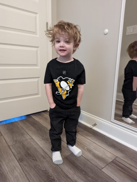 Jack, a child with bilateral profound hearing loss smiling. 