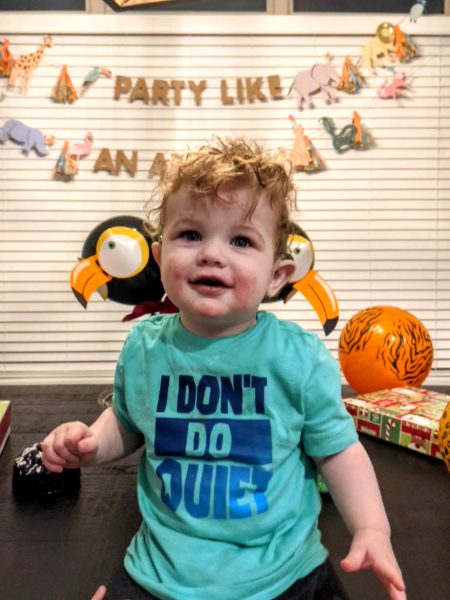 Jack, a child with bilateral profound hearing loss celebrating his cochlear implant activation day. 