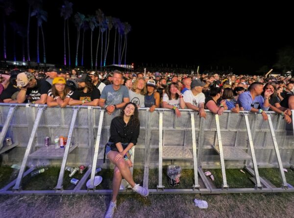 Cochlear employee with hearing loss in Arizona, Emily, at a concert as sign language interpreter.