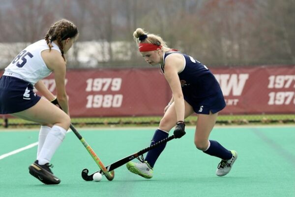 Katelyn who struggled finding a solution for her cholesteatoma, playing field hockey against an opponent