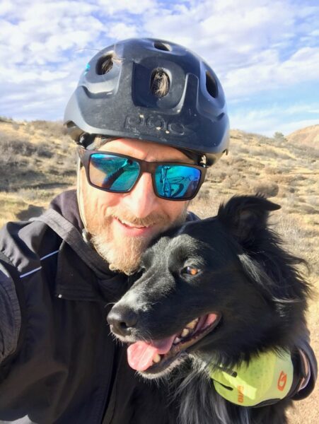 Barry, Cochlear employee with hearing loss in Colorado, with his dog, Bode