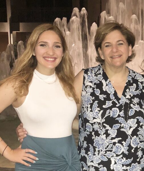 Paula who has confidence from her cochlear implants, posing for a picture with her daughter, who also has cochlear implants. 