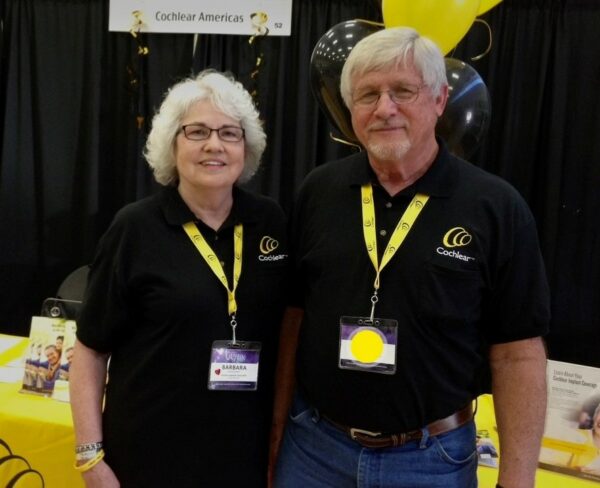 Wayne, the 2022 Hear-o of Year winner, volunteering with his wife at a Cochlear event.