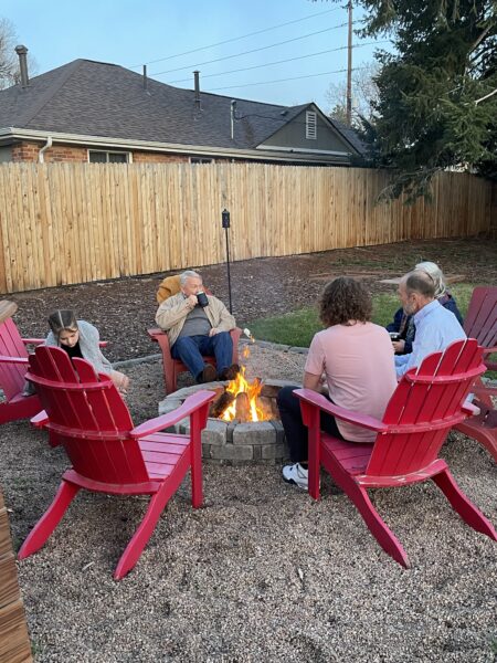 Cochlear implant recipient Mike, enjoying a campfire with his family, on a behind-the-scenes video shoot. 