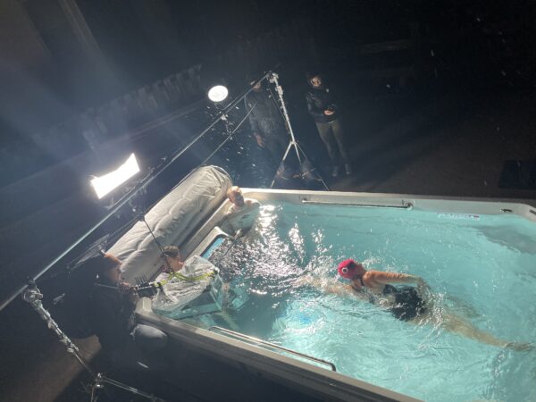 Cochlear implant recipient Kathy, swimming and training for an Ironman race, at her behind-the-scenes video shoot. 