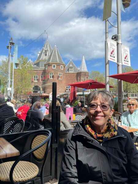 One of the reasons Susan made the decision to upgrade to the Nucleus 8 Sound Processors was to take advantage of hearing more sounds around her. Here she is shown sitting outside at a cafe'.