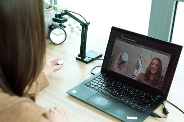 One of our recipients' favorite hearing resources; a Cochlear™ Recipient Solutions manager on her laptop in a virtual appointment.