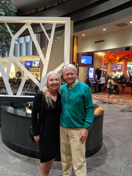 Mike and Marcia, who are cochlear volunteers that found love together, posing for a photo. 