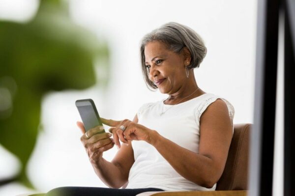 Woman using mobile apps to help boost listening skills