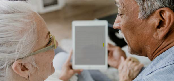 A couple using a tablet; online payment portal