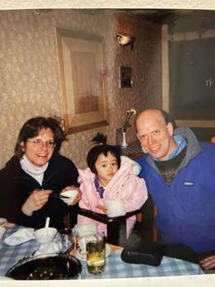 Rachel as a child with her Mom and Dad; Baha Sound Processor features