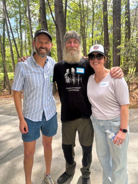 2024 Hear-o of the year, Kelly, standing with his surgeon and audiologist.