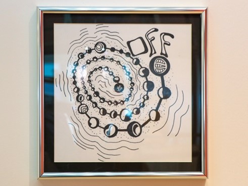 black and white artwork with a spiral chain and the word off; inspire us recipient artwork blog
