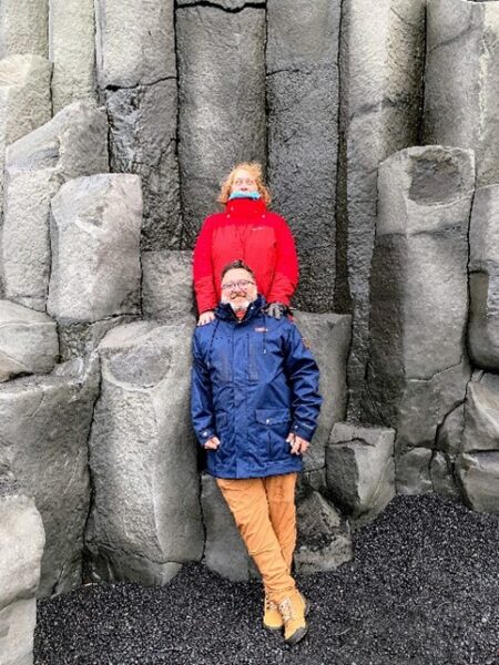 photo of woman standing behind a man in front of a rock sculpture; inspire us recipient artwork blog